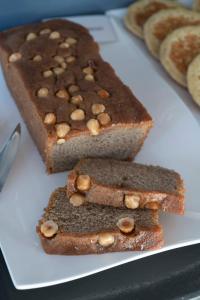 three slices of bread with nuts on top on a plate at Le Spinaker in Le Grau-du-Roi