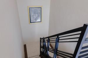 Postel nebo postele na pokoji v ubytování OYO 1566 El Reyshi Family Residence Syariah