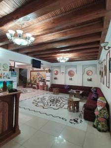 a living room with a couch and a table at Devon Begi Heritage Hotel in Bukhara