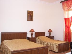Ein Bett oder Betten in einem Zimmer der Unterkunft Hotel MIRA