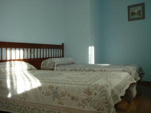 Postel nebo postele na pokoji v ubytování Hostal ** EC León