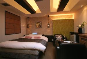 Ένα ή περισσότερα κρεβάτια σε δωμάτιο στο HOTEL BANJAR