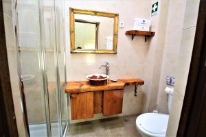 a bathroom with a sink and a shower at Casa do Alentejo in Elvas