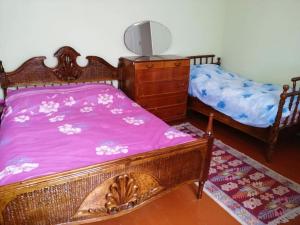 Een bed of bedden in een kamer bij Guest House LALI