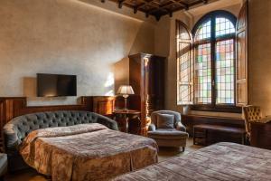 Ліжко або ліжка в номері Grand Hotel Baglioni