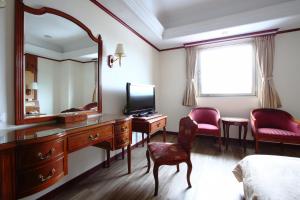 TV a/nebo společenská místnost v ubytování Hua Du Hotel