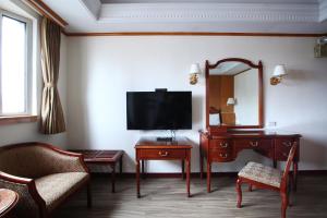TV a/nebo společenská místnost v ubytování Hua Du Hotel