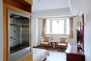 TV a/nebo společenská místnost v ubytování Hua Du Hotel