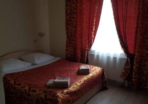 Кровать или кровати в номере Гостиница Диана