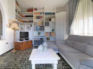 a living room with a couch and a table at Apartment Sandra by Interhome in Le Focette