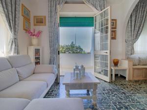 a living room with a couch and a table at Apartment Sandra by Interhome in Le Focette