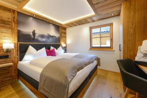 Postel nebo postele na pokoji v ubytování Gams Lodge