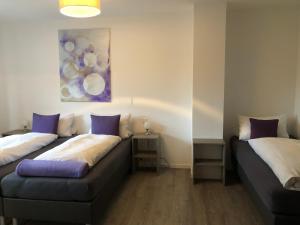 Postel nebo postele na pokoji v ubytování Hotel Hegemann garni