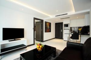 A television and/or entertainment centre at Nova Suites Pattaya by Compass Hospitality