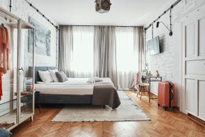 Posteľ alebo postele v izbe v ubytovaní ARTHOTEL STALOWA 52