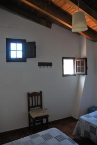 Łóżko lub łóżka w pokoju w obiekcie Casa Rural La Torre
