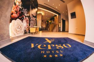 a hotel lobby with a blue rug on the floor at Hotel Verso in Mostar