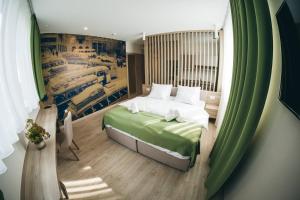 Postel nebo postele na pokoji v ubytování Hotel Verso