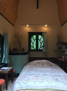 A bed or beds in a room at Garden Shed R