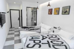 Voodi või voodid majutusasutuse Xiamen Guiran Hostel toas