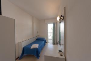 Postel nebo postele na pokoji v ubytování Hotel Ambra