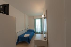 Postel nebo postele na pokoji v ubytování Hotel Ambra