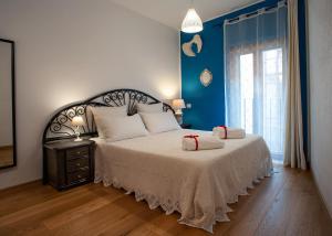 a bedroom with a bed with two towels on it at B&B Buonfiglio Cicconcelli - Terrazza panoramica in Frascati
