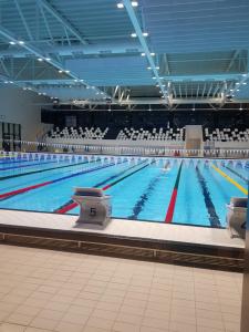 a large swimming pool in a large building at Leut Apartment, 3min beach, 15min center in Pula