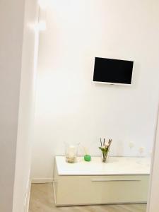 A television and/or entertainment centre at Indipendenza Luxury Apartments