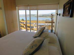 Krevet ili kreveti u jedinici u okviru objekta Riomar Apart Hotel