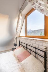 Posteľ alebo postele v izbe v ubytovaní Apartamenty Polana Sywarne Zakopane