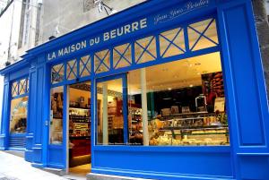 a blue storefront of a store with a store front at Logement entier Saint Malo vue mer, proche FERRY, commerces et plage Solidor 50 m in Saint Malo