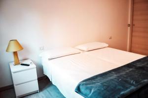 Postel nebo postele na pokoji v ubytování AFFITTACAMERE TORRESI 2