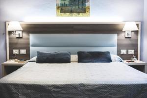 Posteľ alebo postele v izbe v ubytovaní Hotel Il Giardino
