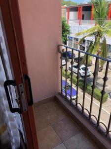 a balcony with a view of a street at Hotel Maria Mixteca in Santa Cruz Huatulco