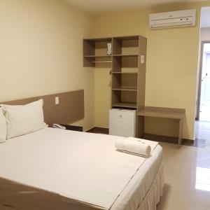 Ένα ή περισσότερα κρεβάτια σε δωμάτιο στο Paracambi Top Hotel