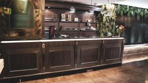 a kitchen with a large wooden island in a room at Meeting Hotel in Casoria