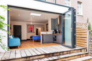 an open kitchen and living room with a glass extension at 144 Lower Cheltenham Place in Bristol