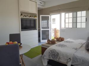 A bed or beds in a room at Apto/Suite Santa Cruz Tenerife