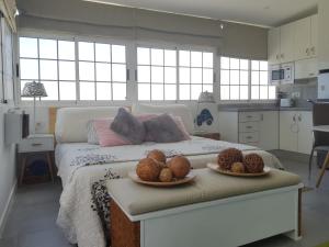 A bed or beds in a room at Apto/Suite Santa Cruz Tenerife