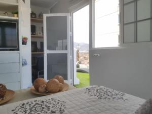 A bed or beds in a room at Apto/Suite Santa Cruz Tenerife