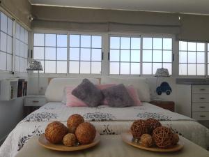 A bed or beds in a room at Apto/Suite Santa Cruz Tenerife