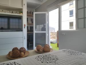 A bed or beds in a room at Apto/Suite Santa Cruz Tenerife