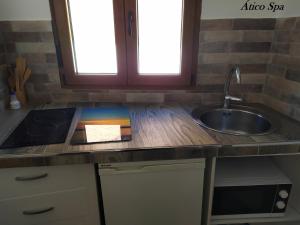 a kitchen with a sink and a counter top at Casas Toya Jacuzzi in Uceda
