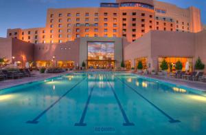 a large swimming pool in front of a hotel at Sandia Resort and Casino in Albuquerque +14 photos