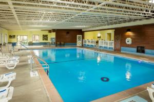 a large indoor swimming pool with blue water at Chestnut Mountain Resort in Galena