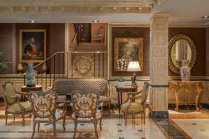 a living room with a table and chairs at Relais & Châteaux Hotel Orfila in Madrid