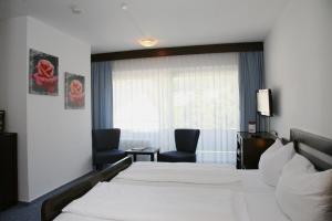 Postel nebo postele na pokoji v ubytování Hotel Pflug