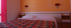 Postel nebo postele na pokoji v ubytování Hotel Vittoria