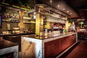 a bar with a marble counter top in a restaurant at Valkenhof in Valkenburg